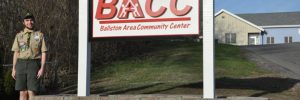 eagle scout helps with new bacc sign